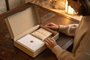 Luxury premium DTC unboxing moment showing magnetic closure, foil stamping, and high-end tactile details