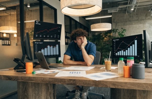 Stressed DTC operations manager looking at rising cost charts due to new EU EPR fees