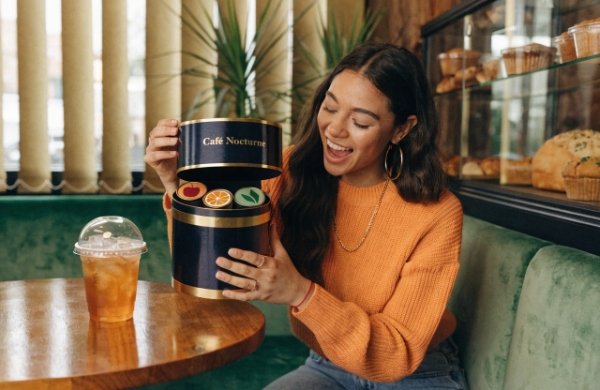 Happy customer enjoying a perfect, secure premium magnetic gift box unboxing experience