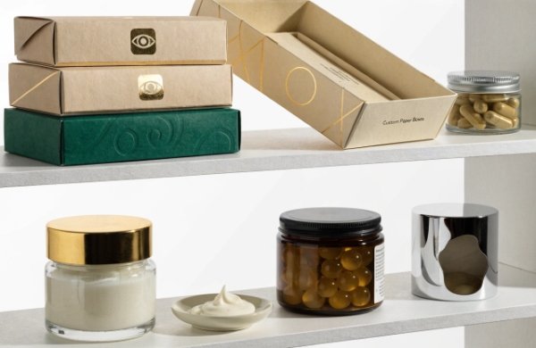 Luxury custom paper boxes displayed on retail shelf next to high-end products