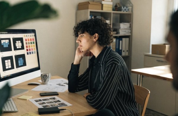 Professional designer checking packaging files on computer before printing