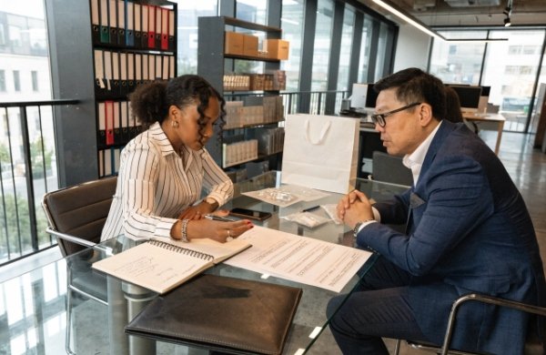 Founder reviewing critical questions with packaging supplier before signing PO